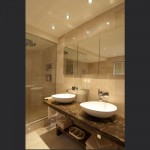 Lime-stone-bathroom-with-his-and-hers-sinks