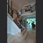 metal-staircase-with-oak-handrails-and-handmade-glass-newl-details